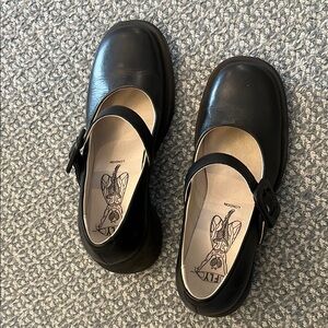 Black leather Mary Jane shoes by Fly London
